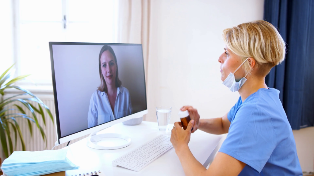 videoblocks side view of woman doctor having video call with patient on laptop online consultation concept hycprf22i thumbnail 1080 01